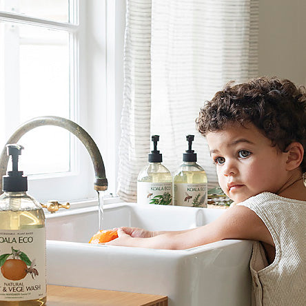 Kid washing hands in sink
