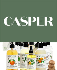 Koala Eco cleaning products with citrus labels and spray bottles.
