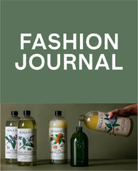 Fashion Journal cover with assorted bottles.