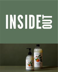 Two Koala Eco citrus scented hand and body lotion bottles on a green background.