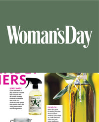 Woman's Day cover with cleaning products and an olive oil bottle.