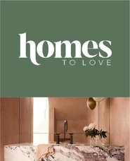 Modern bathroom with a marble countertop and tapware.